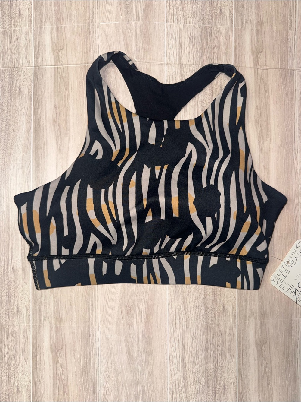 Women's High-Neck Zebra Print Sports Bra - Black & Gray with Gold Accents